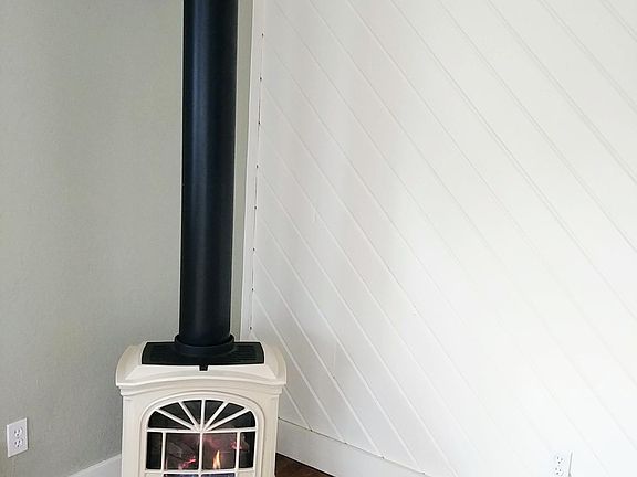 Gas log parlor stove - cozy!