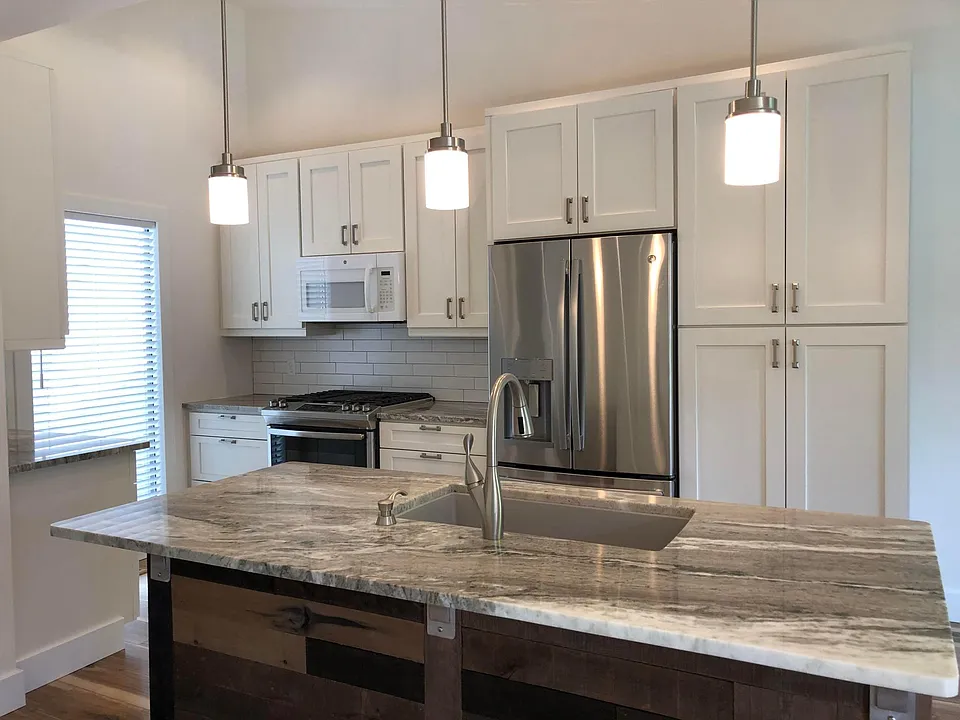 Kitchen island with custom marble counter, granite composite sink with disposal