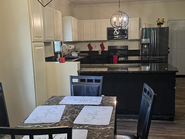 Shared space - spacious living room with couches, TV, coffee table, sofa bed and dining table