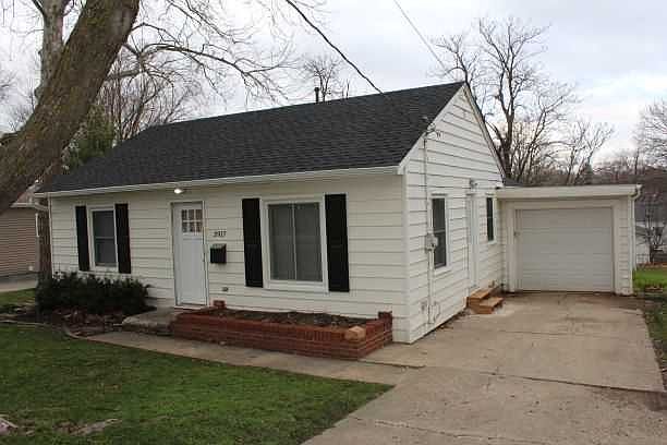 Front exterior of home and attached garage