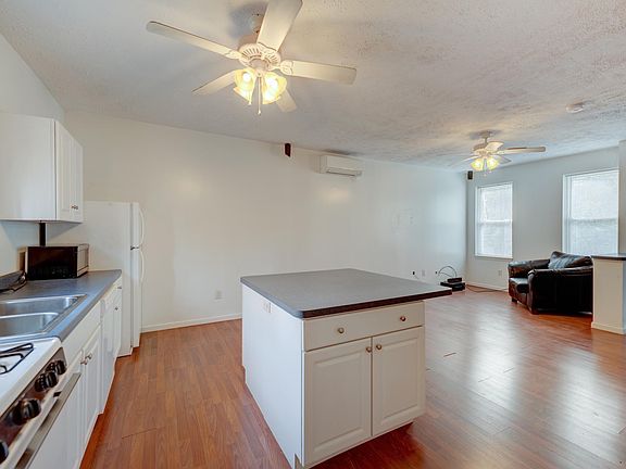 Living Room / Kitchen - microwave, stove, oven, and fridge included