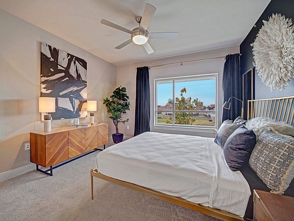 Large Bedrooms with Ceiling Fan and Plush Carpeting