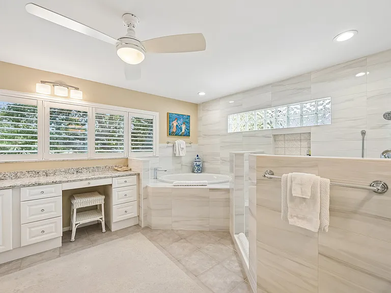 Primary bathroom with tub and shower