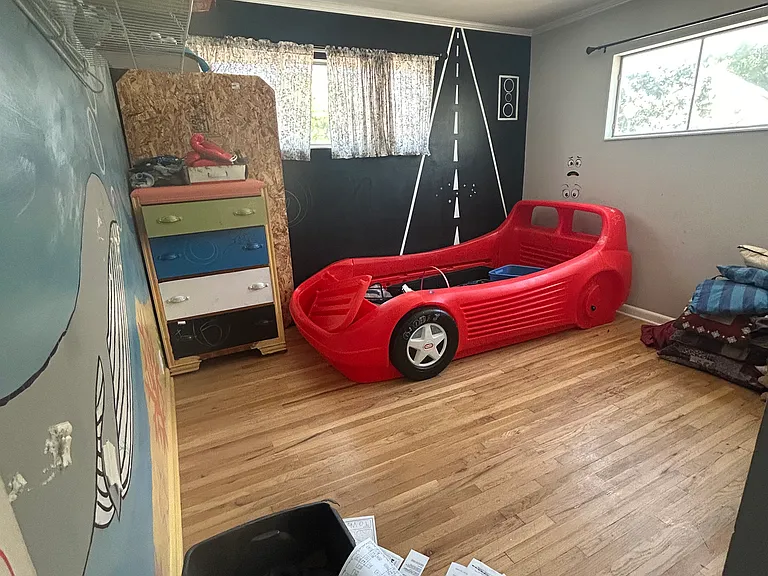Bedroom #1. Large room with hardwood floors, one small closet