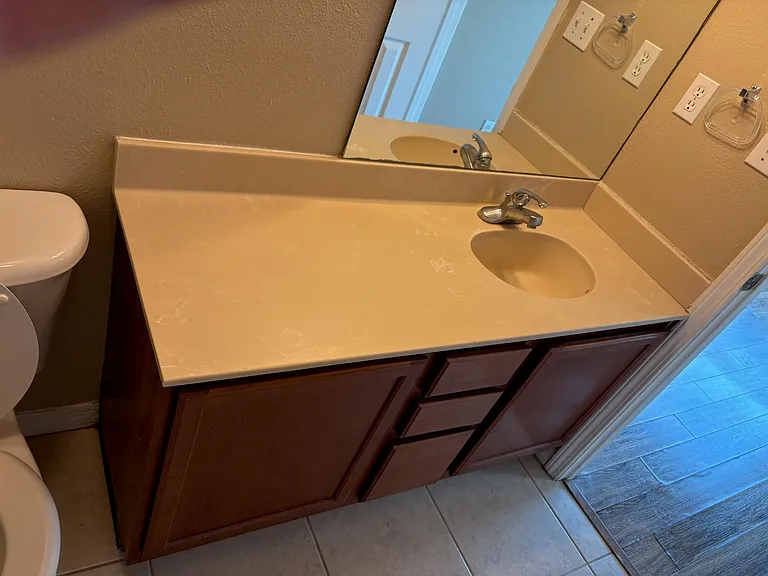 Second bathroom - sink and cabinets