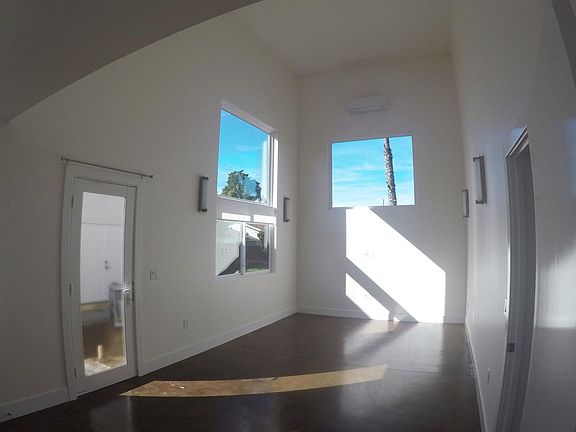 Lofted living area is open to the bedroom above