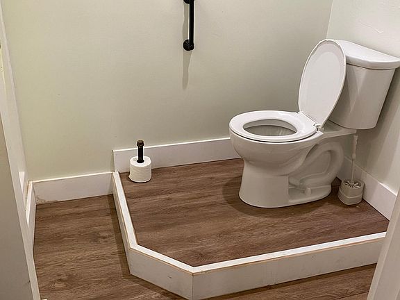 Bath with stand up shower on left