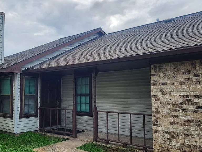 Front porch with garage attached. Washer & Dryer hook up in garage with 2 year roof