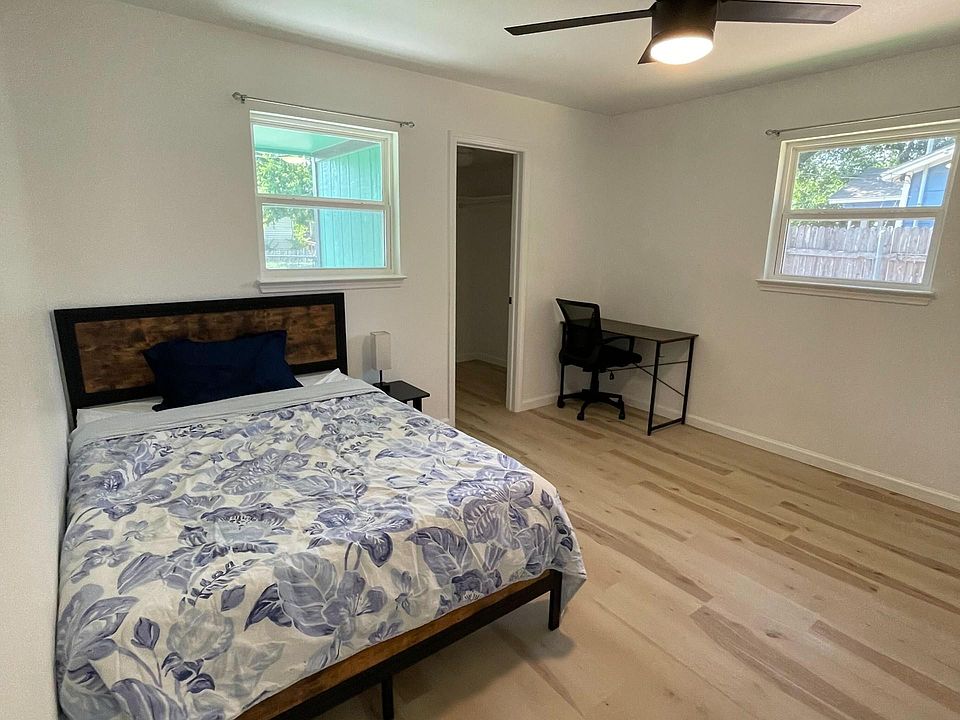 Room A bedroom, desk, and walk-in closet