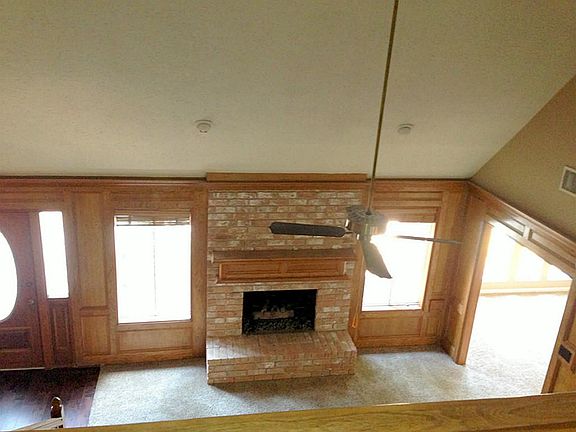 View from the upstairs hall into the living area and study.