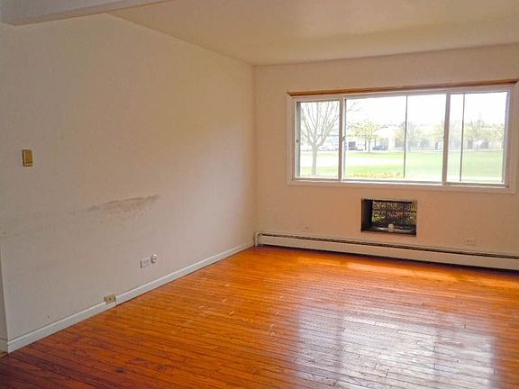 Living Room with Large Windows Ready for Your Homey Touch