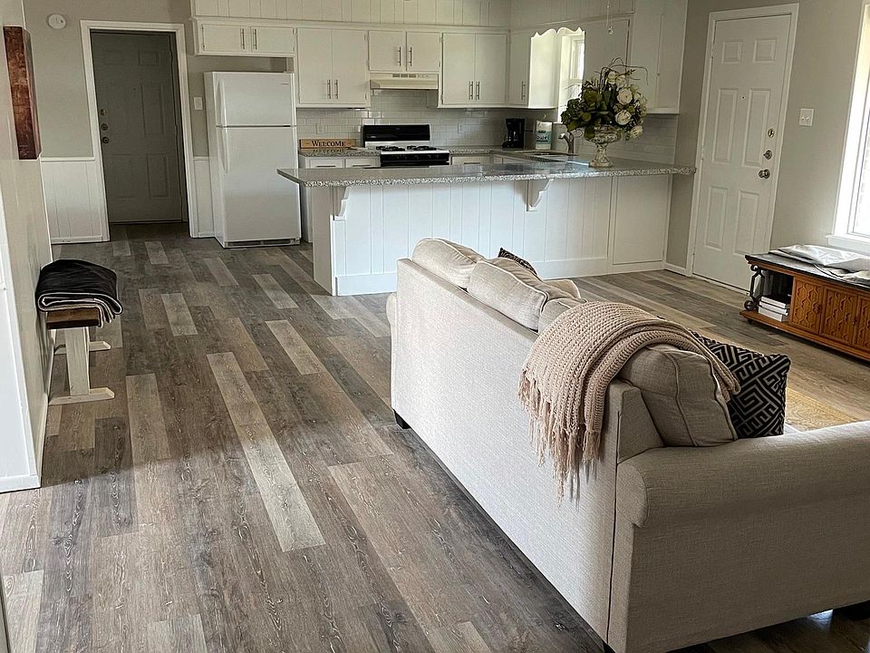 Great open floor plan! Living room and kitchen. Granite countertops, fresh paint, and new flooring
