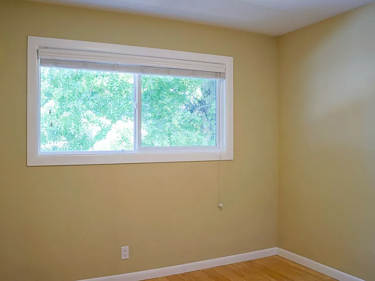 Top-Floor 2-Bedroom with Bamboo Flooring + Off-Street Parking! — Photo 9