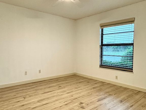 Spacious Primary Bedroom w/ stunning expansive lake views!