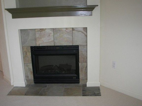 Delightful, warm & cozy Heat & Glow electric fireplace creates an inviting atmosphere.