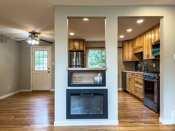 Open living/kitchen/dining area with tons of natural light
