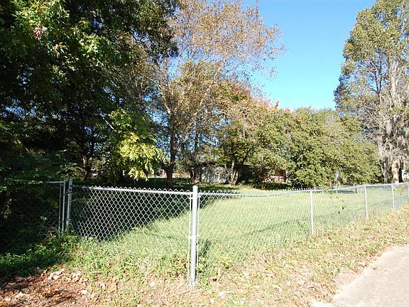 Corner view from Vacant Lot of all three