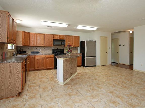 This kitchen defines SPACIOUS! Plenty of room to gather!