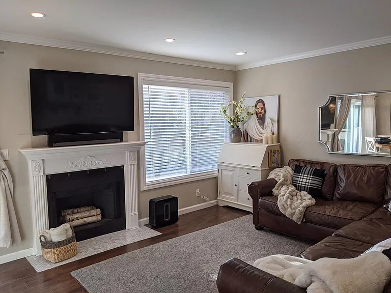 Family room. Hardwood floors throughout. Marble on the floor near fireplace. Crown molding and recessed lights all on dimmers throughout entire home.