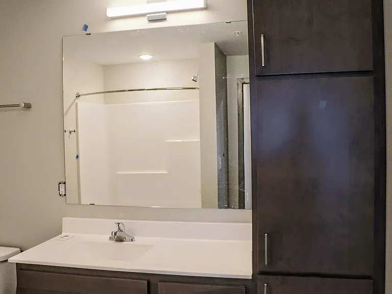 Open and airy shower and vanity spaces.