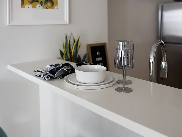 Grant park village shot of plates and wine glasses on kitchen bar