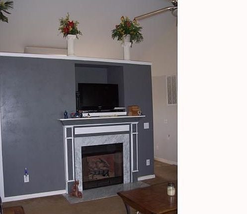 Built in for Television above fireplace.
