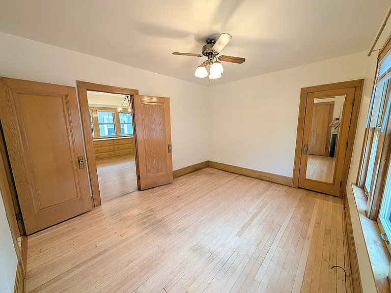 View from main bedroom looking into dining room