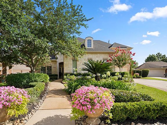 An impressive home of 4,519 sq.ft living space, located on a 15,420 sq.ft lot with gorgeous curb appeal.