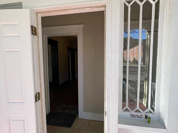 Secure front door entry into front vestibule to Apartments A and B