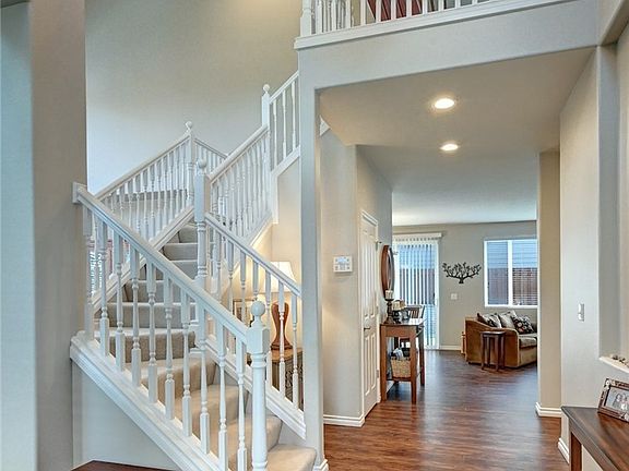 New flooring welcomes you home with open staircase.