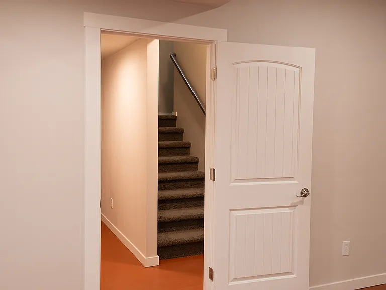 view of the landing from the staircase to the basement