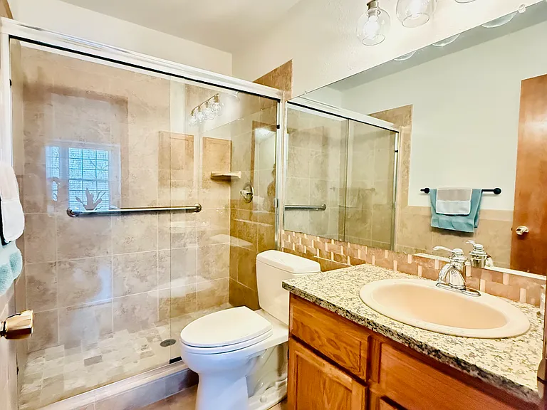 Second full bathroom upstairs attached with second bedroom.