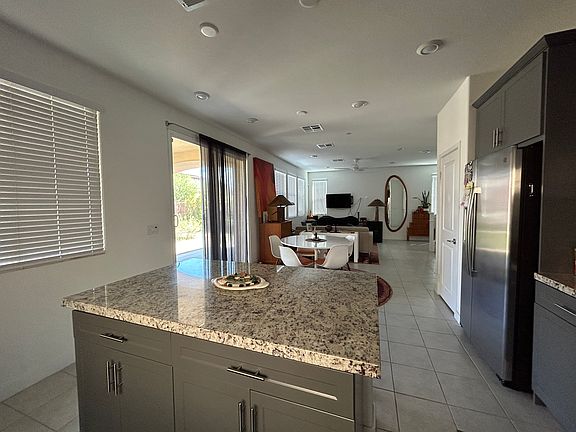 kitchen opens to dining and living area