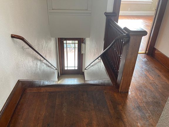 Top of stairway and entrance into front door of apartment