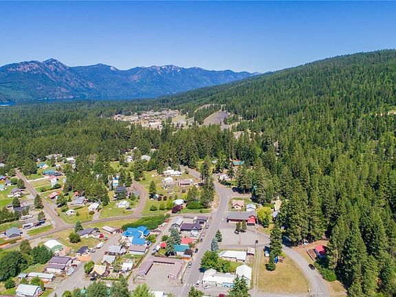 Home sits in tree line. 