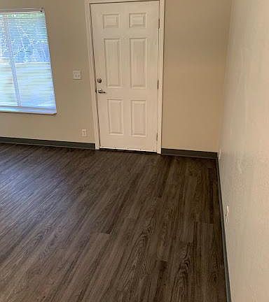 New vinyl flooring in the living room of this beautiful apartment