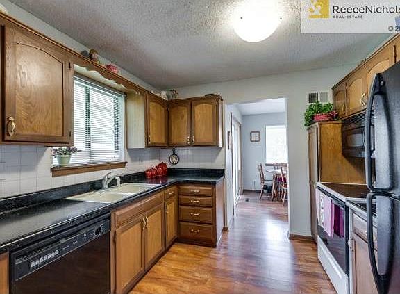 Kitchen view to breakfast room and access to backyard.