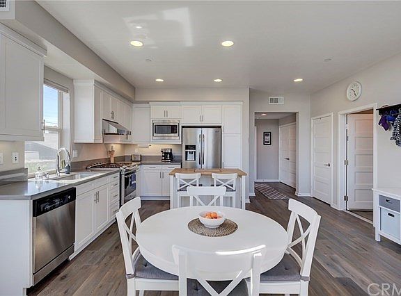Dining area and recess lighting.  Hallway leads to 2 bedrooms and a full bath.