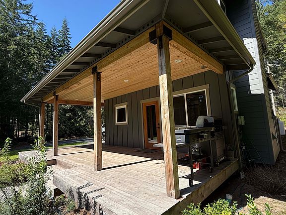 Covered deck with plenty of space for outdoor living.