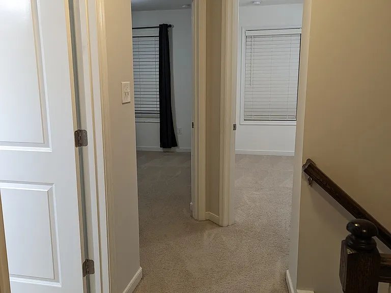 Stairs to main floor (right), Full bath (on left) & two bed rooms; Note: Carpet in this is replaced with Grayis color carpet