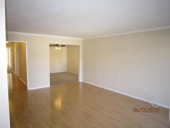 Main Living Room Area - Have since installed folding doors to Bed3/Den/Office