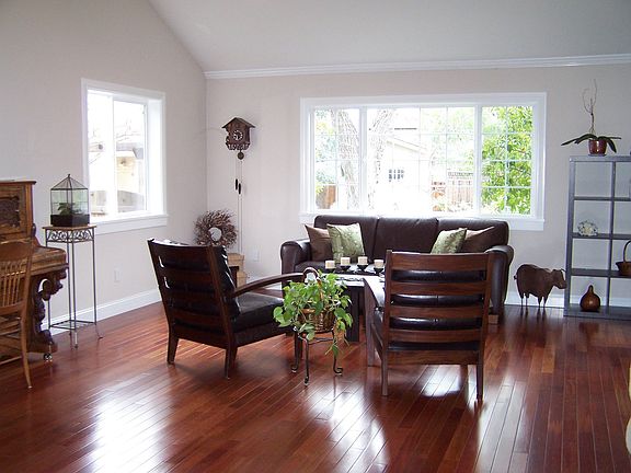 Gorgeous living room with Brazilian cherry floors and vaulted ceilings