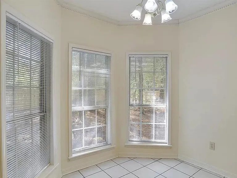 Eat in area. Lots of windows! Bright and view into back yard