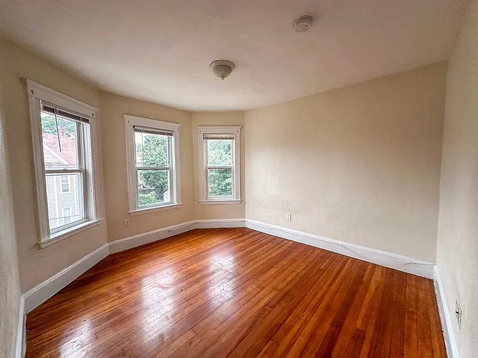 Second bedroom with 9-foot ceilings and abundant natural light.