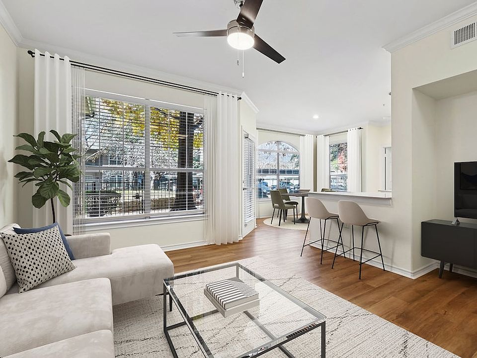 Renovated Package I living room with hard surface flooring