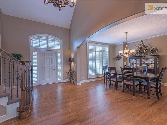 Wood Floor on main level just refinished --- Plantation Shutters throughout the home