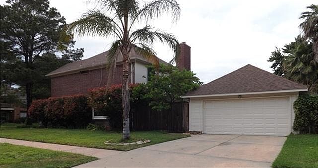 Garage entrance is located on the side of the home.