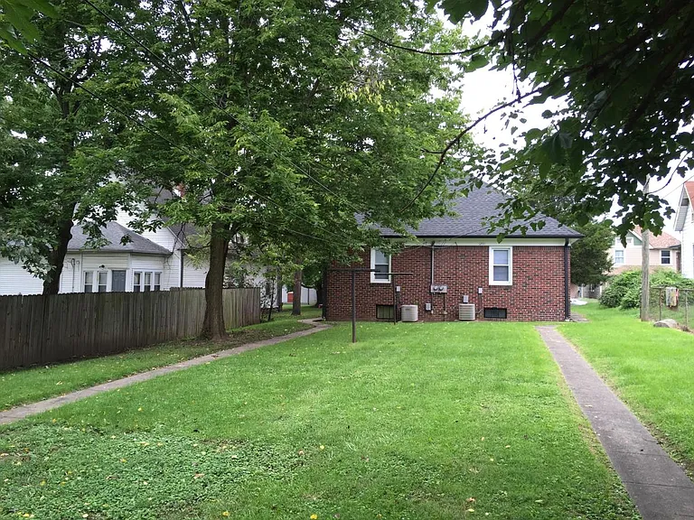 Off street gravel parking behind property along with a nice back yard.