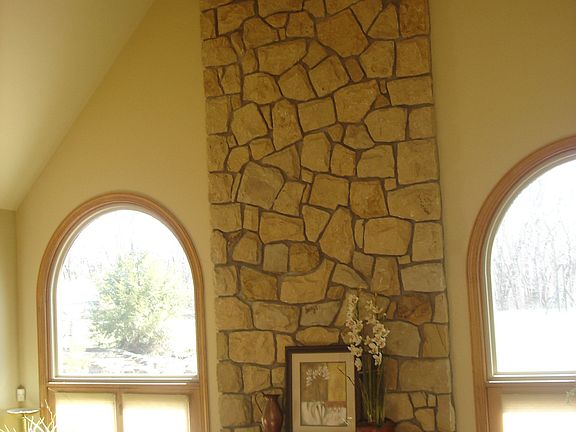 Stone fireplace with gas starter.