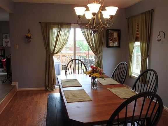 Step down into this dining room where you will find sliding doors to deck